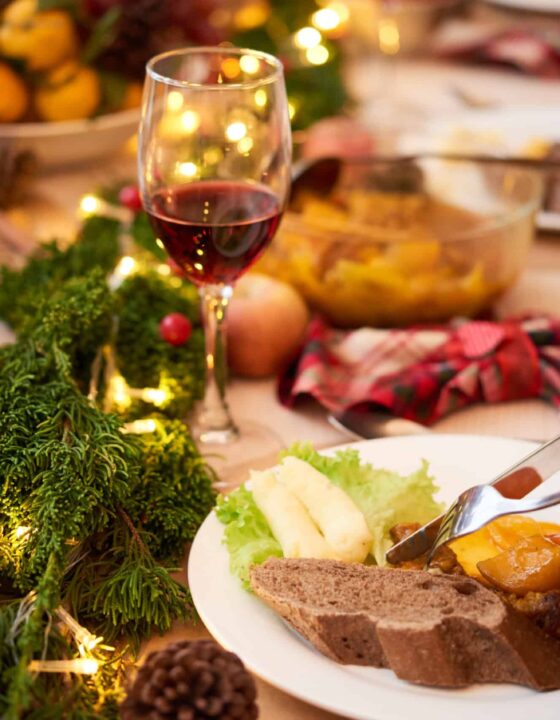 Guest eating delicious dishes at Christmas dinner