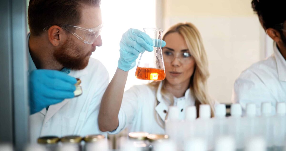 Young students of chemistry working together in laboratory