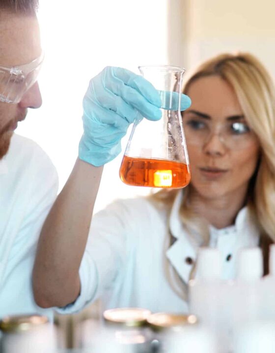 Young students of chemistry working together in laboratory